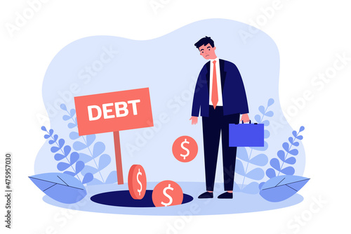 Photo Businessman with stress standing near debt hole