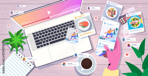 blogger sharing and watching photos at social networks making posts for followers social media addiction concept