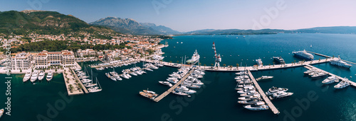 Luxurious expensive yacht resort of Porto with mountains in the background. Montenegro