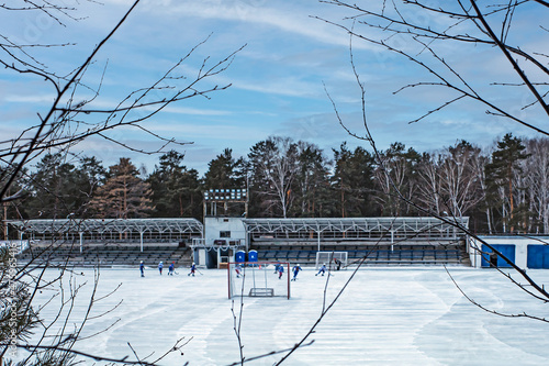 Training of the children's bandy team on a winter day photo