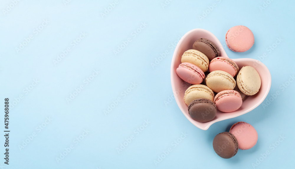 Homemade macaroons in heart bowl Homemade macaroons in heart bowl