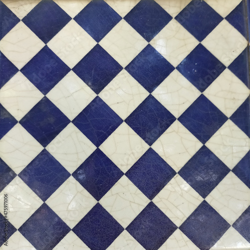 Wall with checkerboard blue and white tiles photo