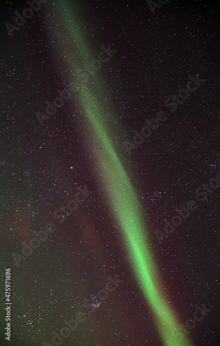 Mesmerizing view of Aurora Borealis seen from Kattfjorden, Kvaloya, Arctic region in Norway photo