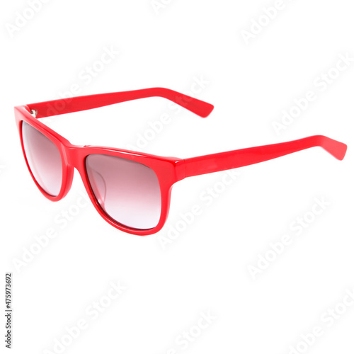 Red glasses frames on white background. Sun goggles and glasses for vision in red frames.