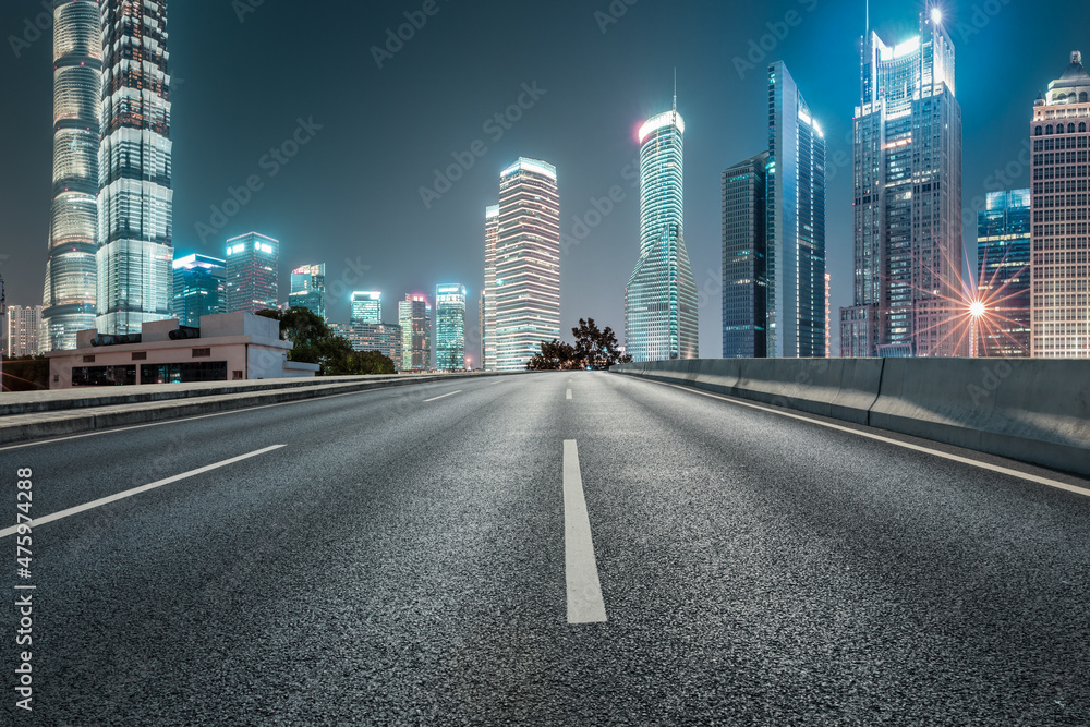 Naklejka premium Panoramic skyline and modern commercial buildings with empty road in Shanghai