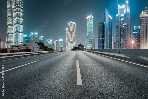 Panoramic skyline and modern commercial buildings with empty road in Shanghai © ABCDstock