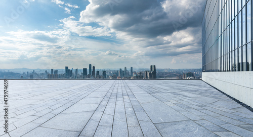 Fototapeta Naklejka Na Ścianę i Meble -  Empty floor with modern city skyline and buildings