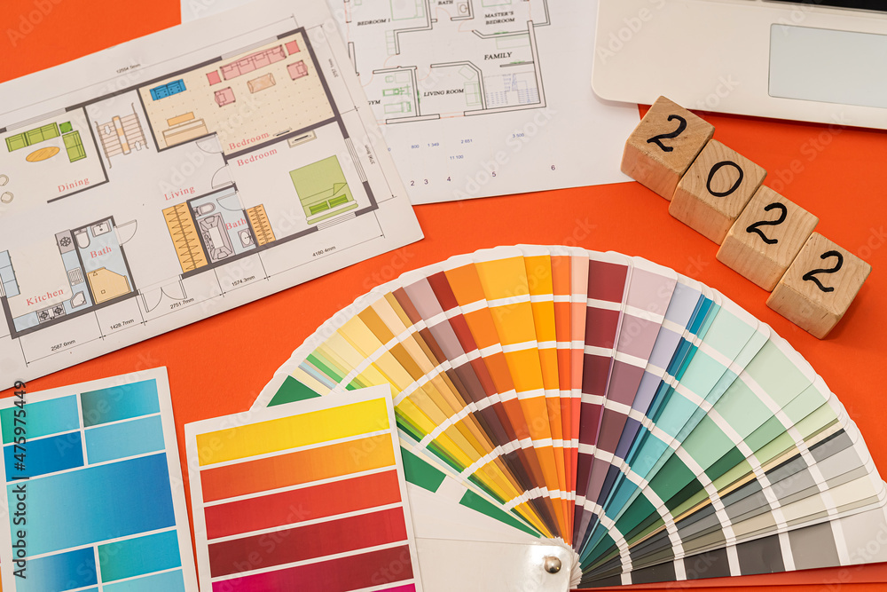 Architectural color floor plan with color swatches on desk Stock Photo ...