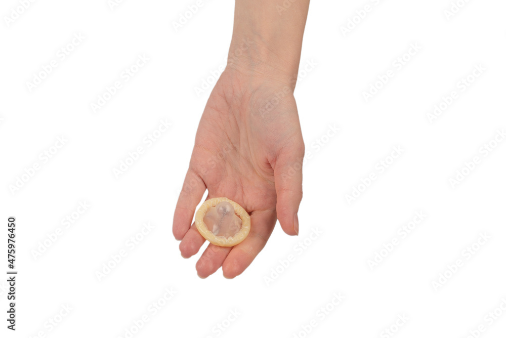 Condom in woman hand isolated on white background. Condom in woman hand isolated on white background.