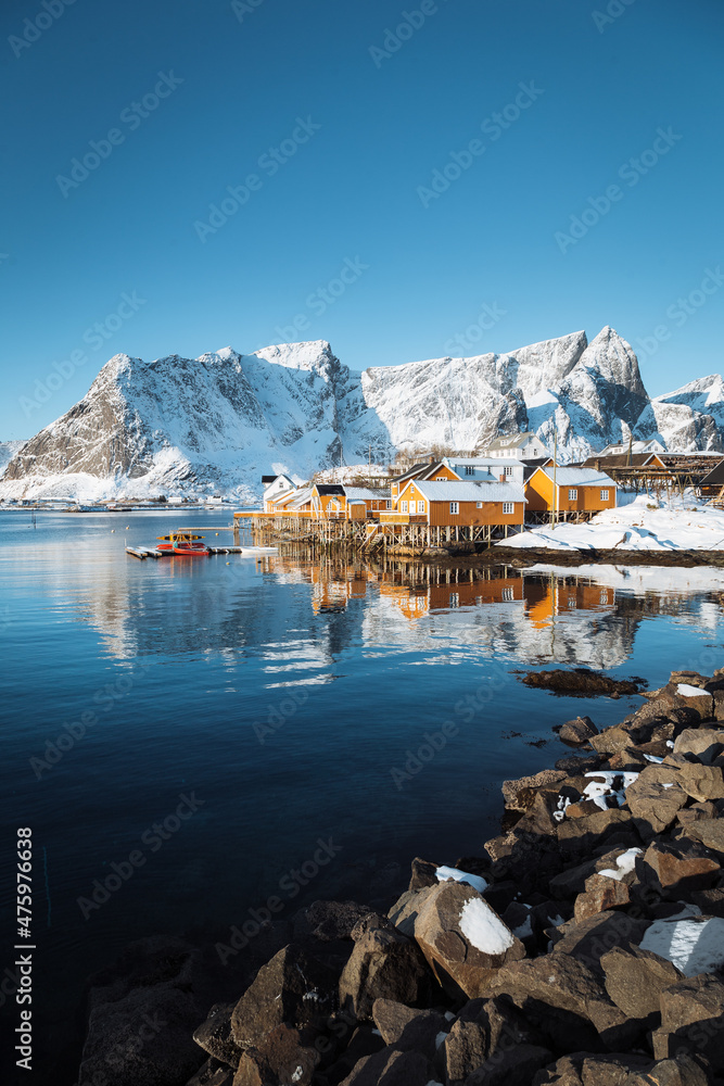 Lofoten winter scenery with traditional fisherman Rorbuer cabins, Sakrisoy, village of Reine, Norway
