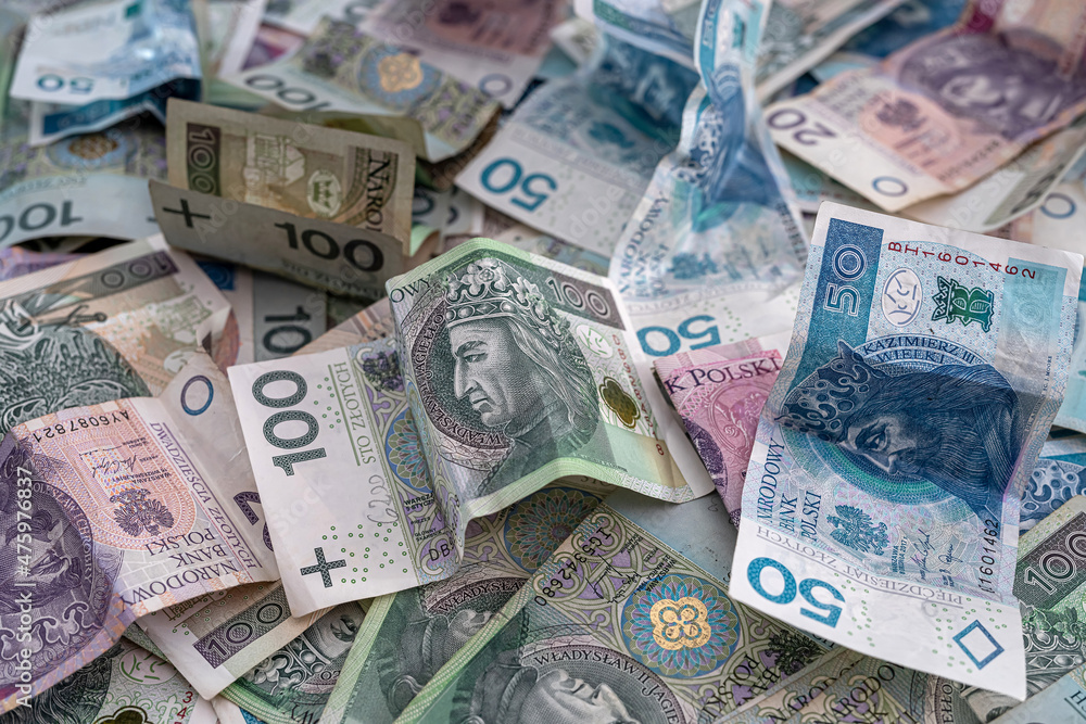 Obraz premium pile of polish banknotes zloty as financial background