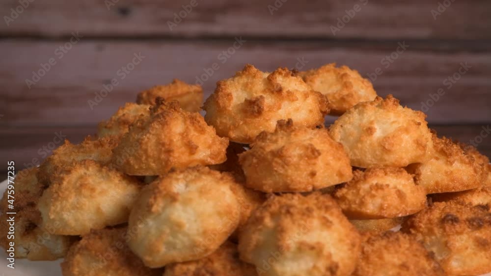 Rocher coco from coconut dessert in brown color make with white eggs and sugar. Rocher coco from coconut dessert in brown color make with white eggs and sugar.