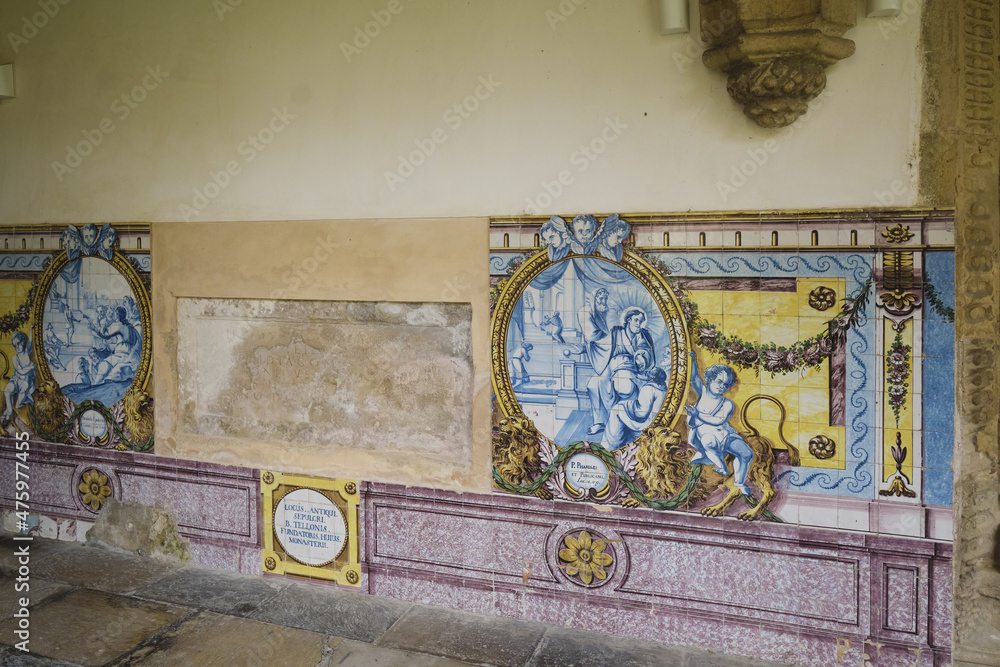 panel of azulejos in the cloister courtyard of The New Cathedral of Coimbra or the Cathedral of the Holy name of Jesus in Coimbra, Portugal