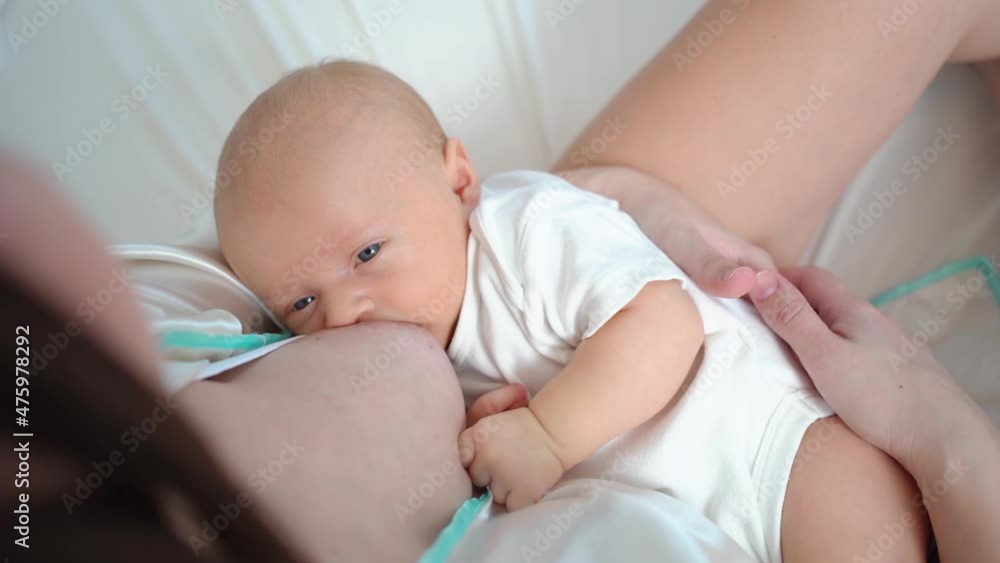 breastfeeding. view from above. the mother feeds the baby with breast milk. breastfeeding. view from above. the mother feeds the baby with breast milk.