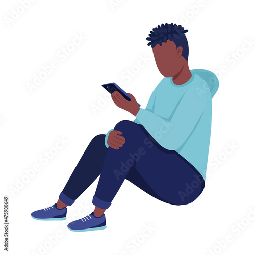 Young boy looking at phone semi flat color vector character. Sitting figure. Full body person on white. Late adolescence isolated modern cartoon style illustration for graphic design and animation