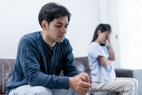 Asian man are disappointed and saddened after an argument with wife. Asian couples are having family problems resulting in divorce. Lover broken and Love problem