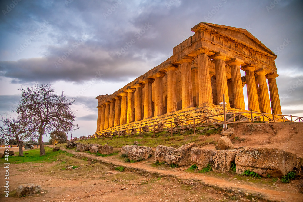 Temple of Concordia in the Valley of the Temples at sunset in Agrigento - Sicily, Italy.