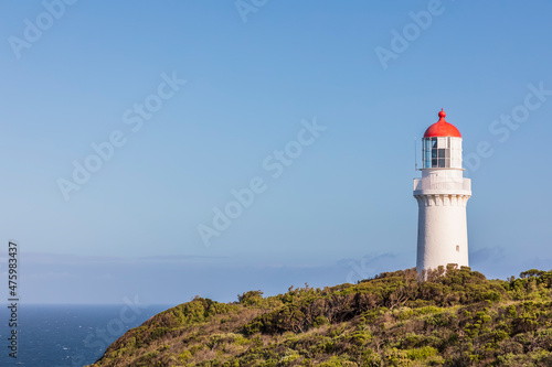 Australia, Victoria, Cape Schanck, Cape Schanck Lighthouse standing against clear blue sky photo