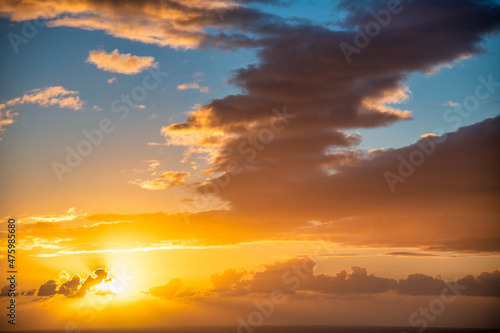 Amazing colors of beautiful sunset over the ocean, red, yellow and blue colors. © jovannig