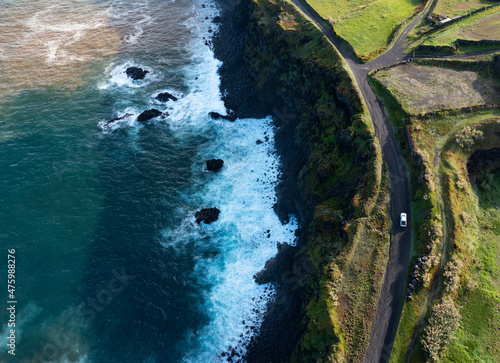Portugal, Azores, Ribeira Grande, Drone view of dirt road stretching along edge of Sao Miguel Island