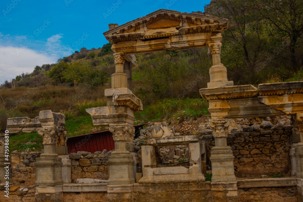 Naklejka premium EPHESUS, TURKEY: On Kuretov Street, the Fountain of Troyan and the ruins of the ancient city of Ephesus.