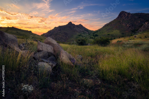 Sunset scene in Macin mountains with some rocks in the foreground