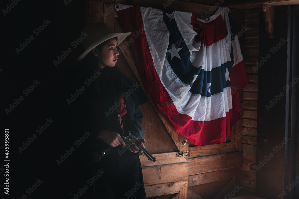 Cowboy posing with rifle gun on hand to show protected weapon ,vintage style.