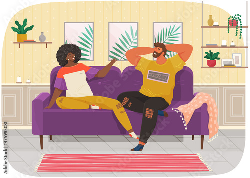 Couple sitting on couch at home in living room interior and talking. Family stay at home, communicating. Man and woman enjoy together, discussing plans for future. Young family spend time together