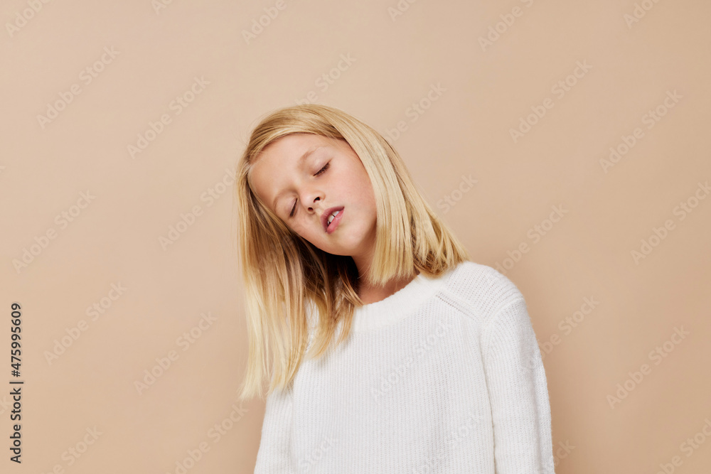 Portrait of a smiling little cutie with blond hair posing studio Portrait of a smiling little cutie with blond hair posing studio