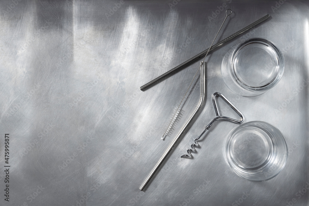Top view of empty silver tray and two glasses for drinks,metallic cocktails sticks on it.Free space Top view of empty silver tray and two glasses for drinks,metallic cocktails sticks on it.Free space