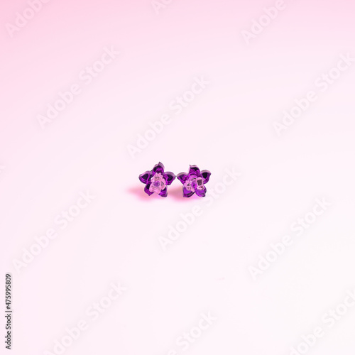 Material methacrylate with a flower shape design on a pastel color background. photo