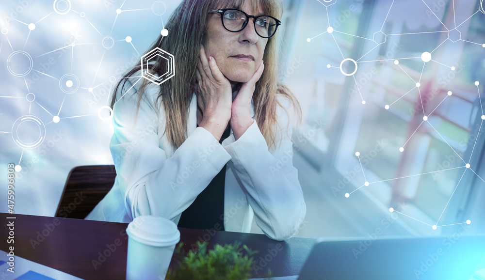 Portrait of thoughtful mature businesswoman; light effect Portrait of thoughtful mature businesswoman; light effect