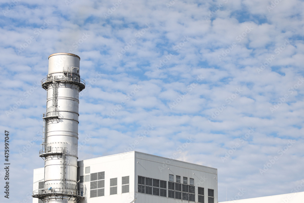 Industrial view of building and chimney.