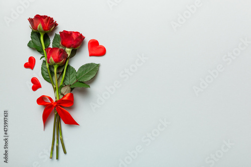 Fototapeta Valentine day composition with rose flower and red heart on table