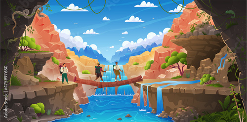 People walk on makeshift log bridge among rocks. . Tourists walk on log lying on stones. Wildlife, nature landscape with waterfall, rocks, tropical plants. Tourist route in mountainous terrain