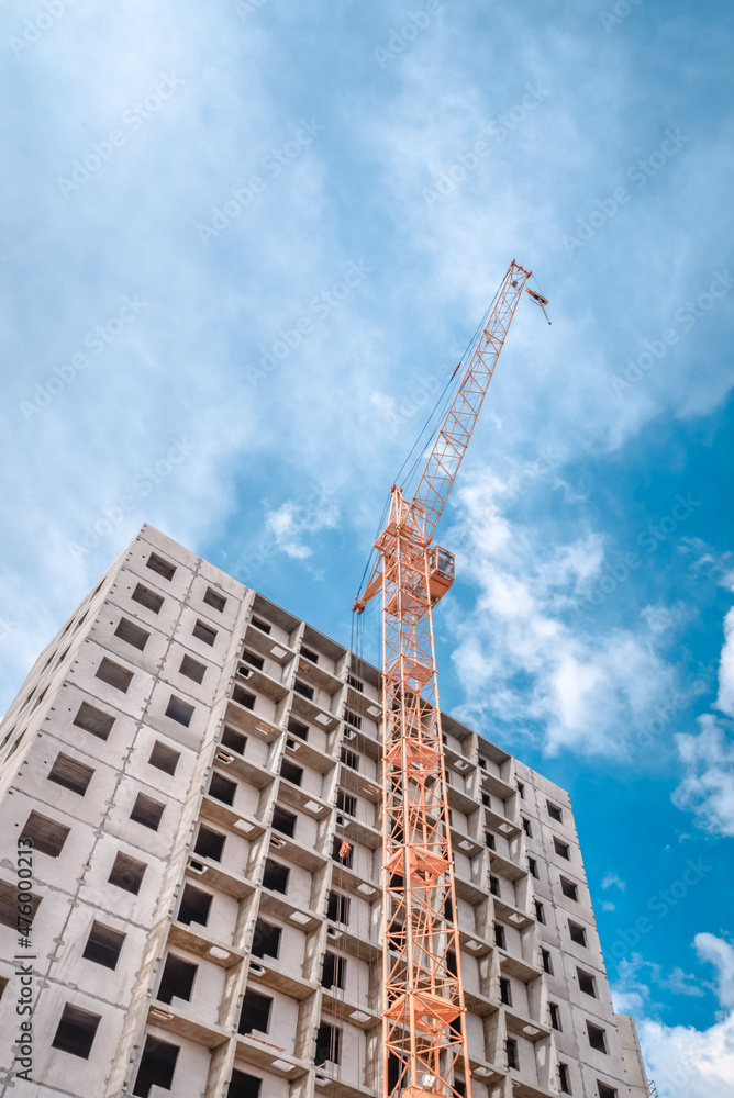 Fototapeta premium Building of new apartments and crane