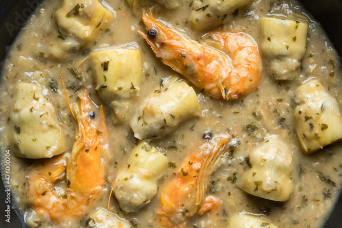 Overview of artichokes recipe with prawns and green sauce