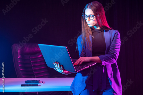 A businesswoman with a lapt...