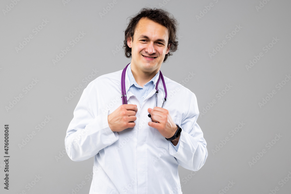 Portrait of a medical doctor posing against white background Portrait of a medical doctor posing against white background