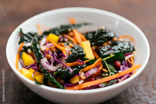 Home made salad with lentils, kale, carrots, red cabbage, onion and pomegranate arils.