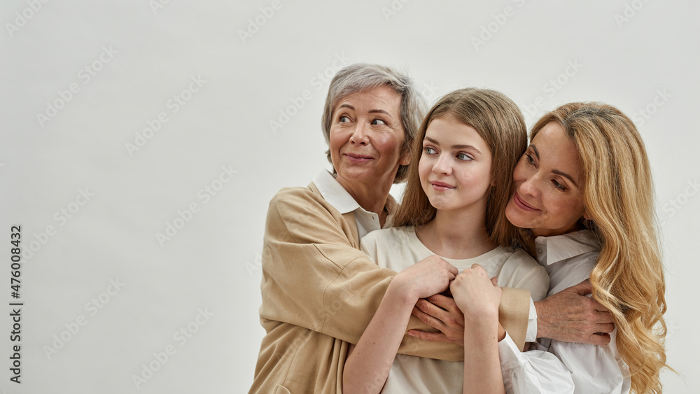 Grandma, mother and gramdkid hug and look away Grandma, mother and gramdkid hug and look away