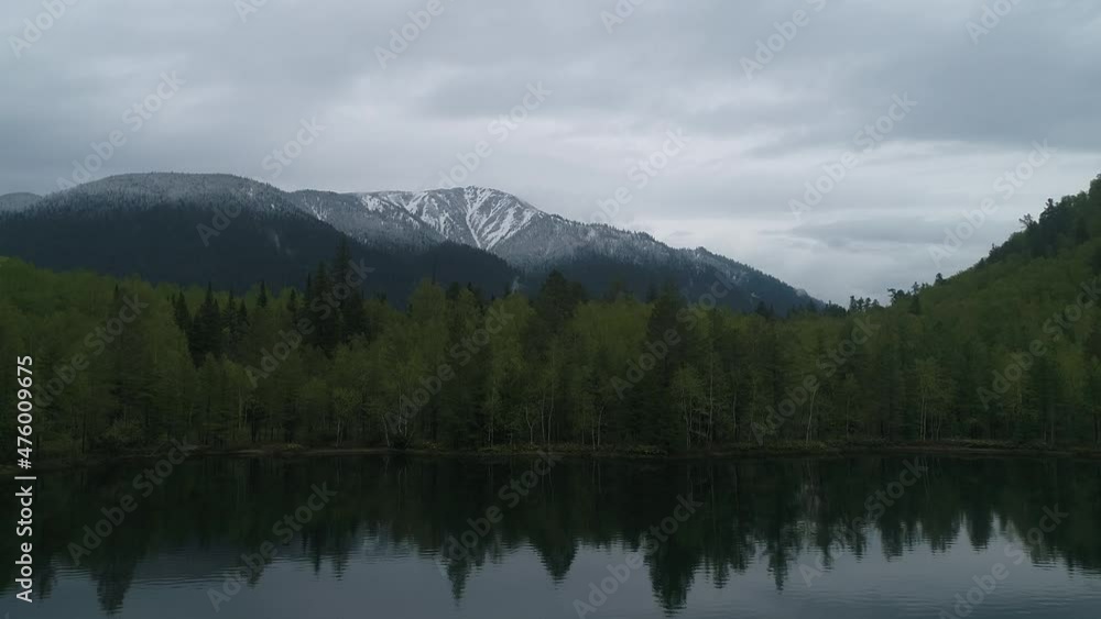 Foggy misty mountain landscape with fir forest and in vintage retro hipster style, Baikalsk. Lake Snezhnoe. Foggy misty mountain landscape with fir forest and in vintage retro hipster style, Baikalsk. Lake Snezhnoe.