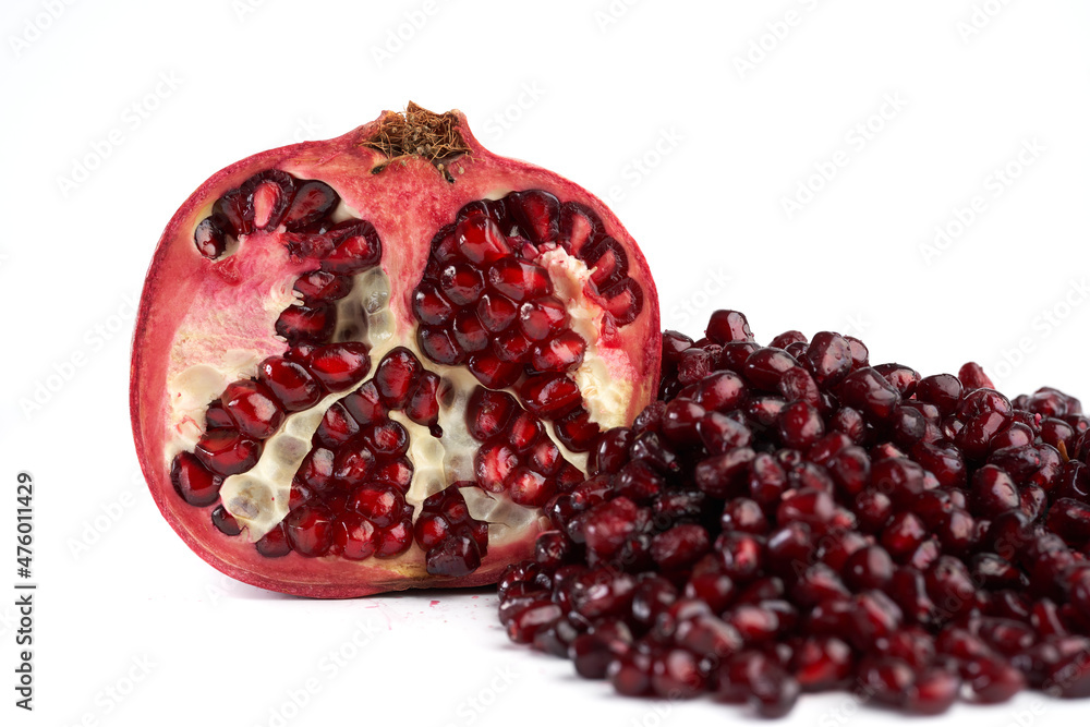 Pomegranate fruits and seeds on whit ebackground