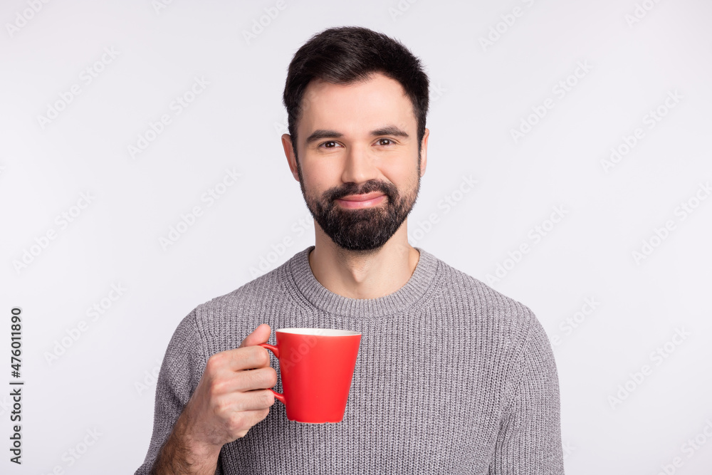 Photo of handsome guy enjoy morning coffee break cup drink rest cappuccino isolated on grey color background Photo of handsome guy enjoy morning coffee break cup drink rest cappuccino isolated on grey color background