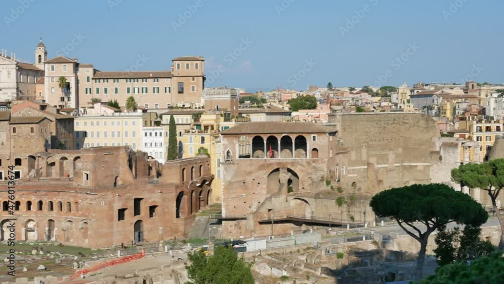 ROME - AUGUST 21, 2019: View on ancient buildings, green pine trees and Colosseum at the sunset in Rome. 4K, Pan ROME - AUGUST 21, 2019: View on ancient buildings, green pine trees and Colosseum at the sunset in Rome. 4K, Pan