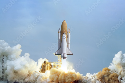 Fototapeta Naklejka Na Ścianę i Meble -  Spaceship takes off into the sky. Rocket starts into space. Concept “Elements furnished by NASA”
