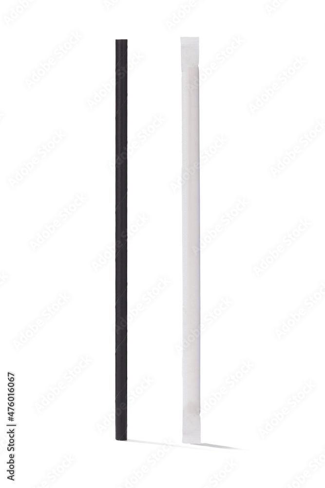 Detailed shot of a black paper cocktail straw and the same straw in the white individual packaging. The cocktail straws are isolated on the white background. Detailed shot of a black paper cocktail straw and the same straw in the white individual packaging. The cocktail straws are isolated on the white background.