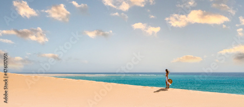 Fototapeta Naklejka Na Ścianę i Meble -  Woman in beachwear standing on beach