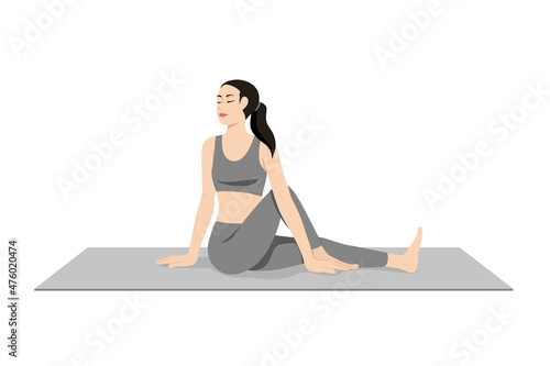Twisted Pose, Beautiful girl practice Vakrasana. Young attractive woman practicing yoga exercise. working out, black wearing sportswear, grey pants and top, indoor full length, calmness and relax. photo