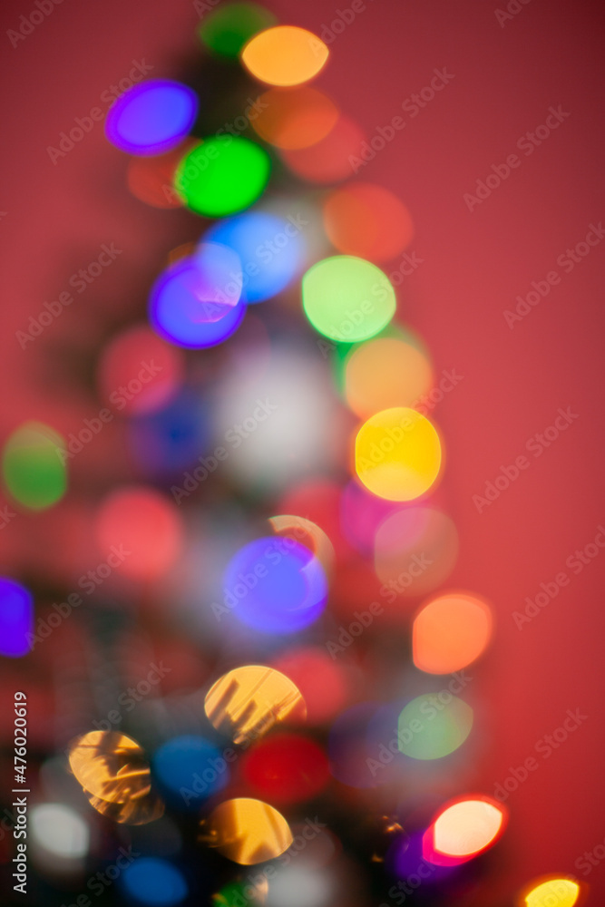 Christmas, blurred bokeh of Christmas lights on the Christmas tree, New Year. Christmas, blurred bokeh of Christmas lights on the Christmas tree, New Year.